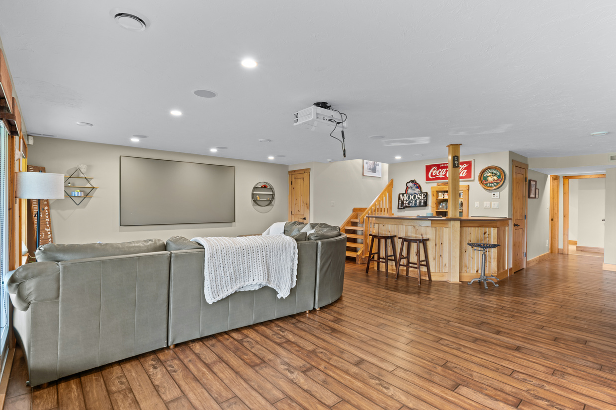 Lower-level entertainment area with built-in bar