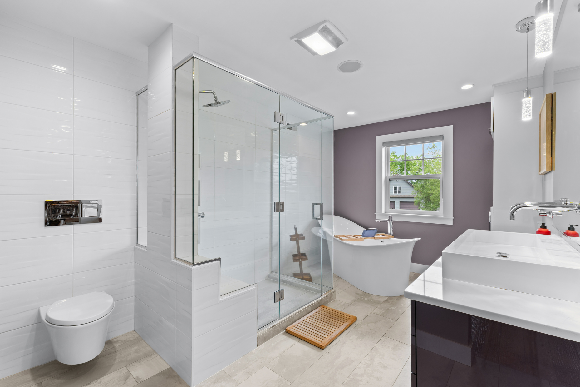 Primary bathroom with freestanding tub and glass shower